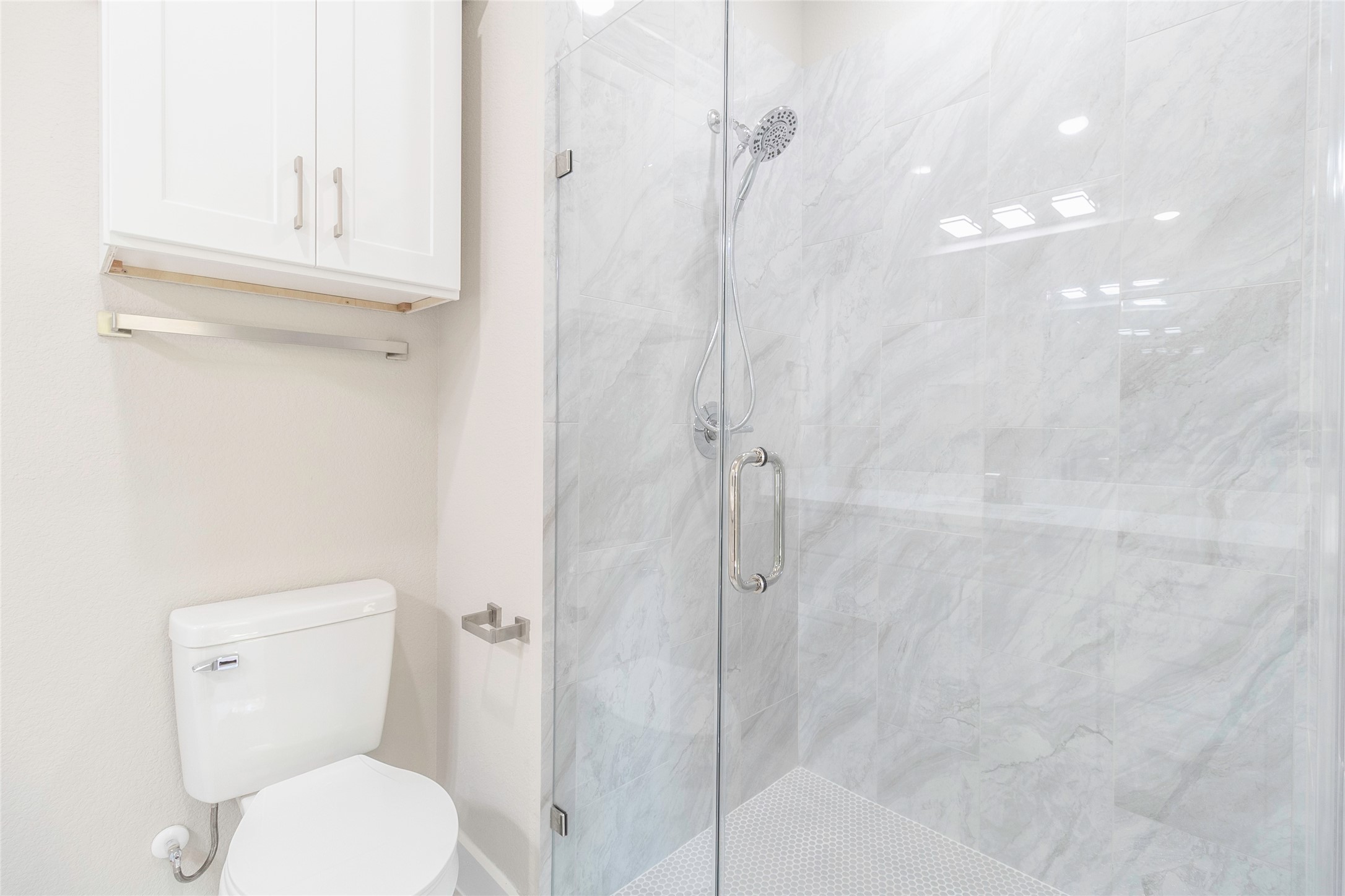 9821 Richcroft Street Houston, TX 77029 - Photo 11 of 15 a bathroom with a toilet and a shower