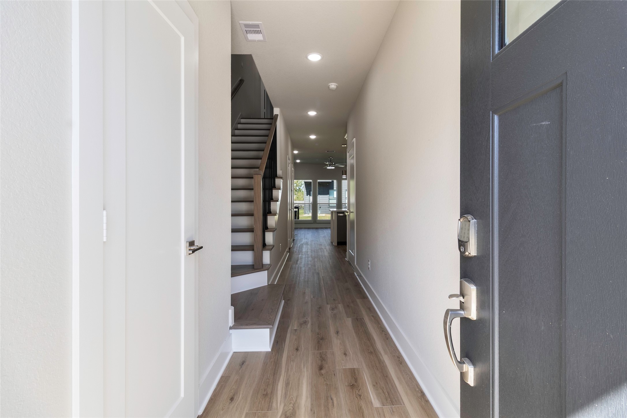 9821 Richcroft Street Houston, TX 77029 - Photo 3 of 15 a view of hallway with wooden floor