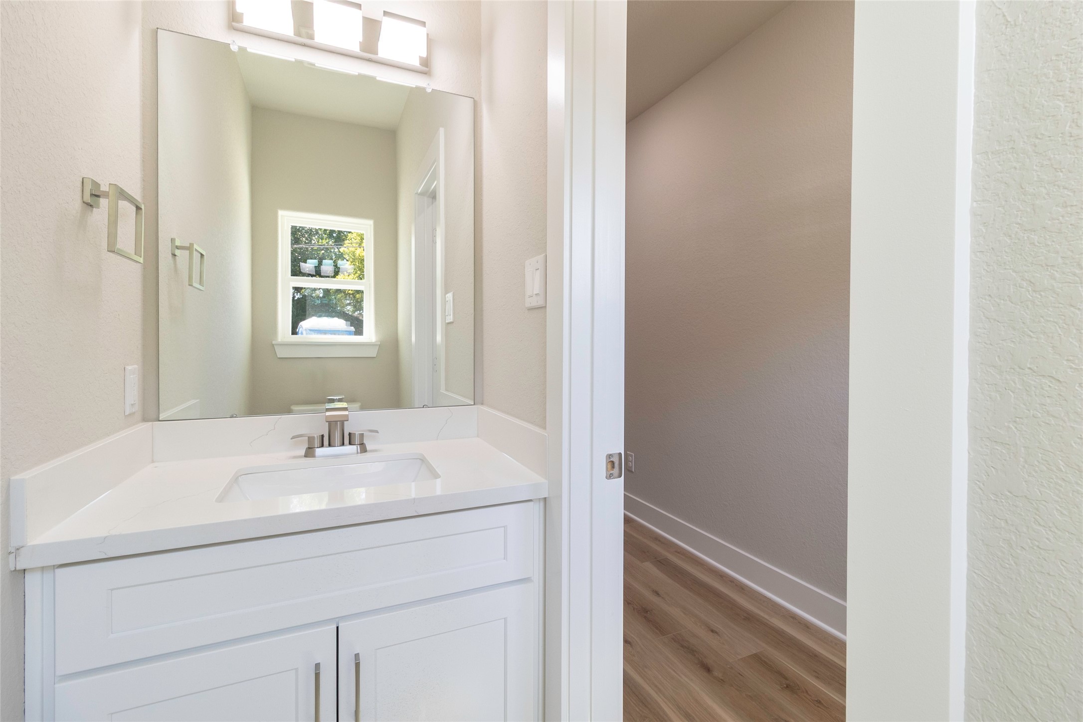 9821 Richcroft Street Houston, TX 77029 - Photo 4 of 15 a bathroom with a sink and a mirror