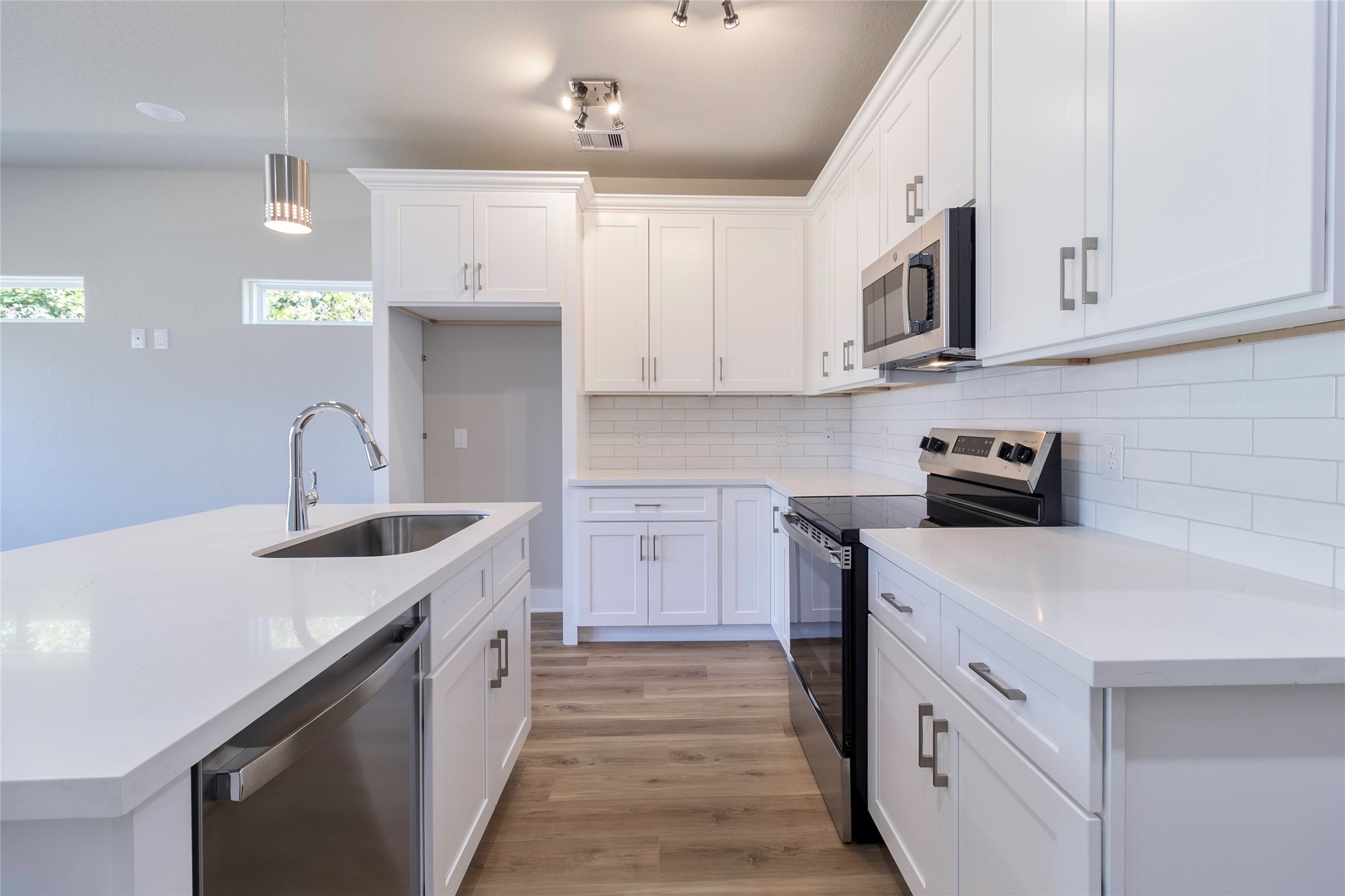 9821 Richcroft Street Houston, TX 77029 - Photo 5 of 15 a kitchen with stainless steel appliances granite countertop a sink stove and cabinets