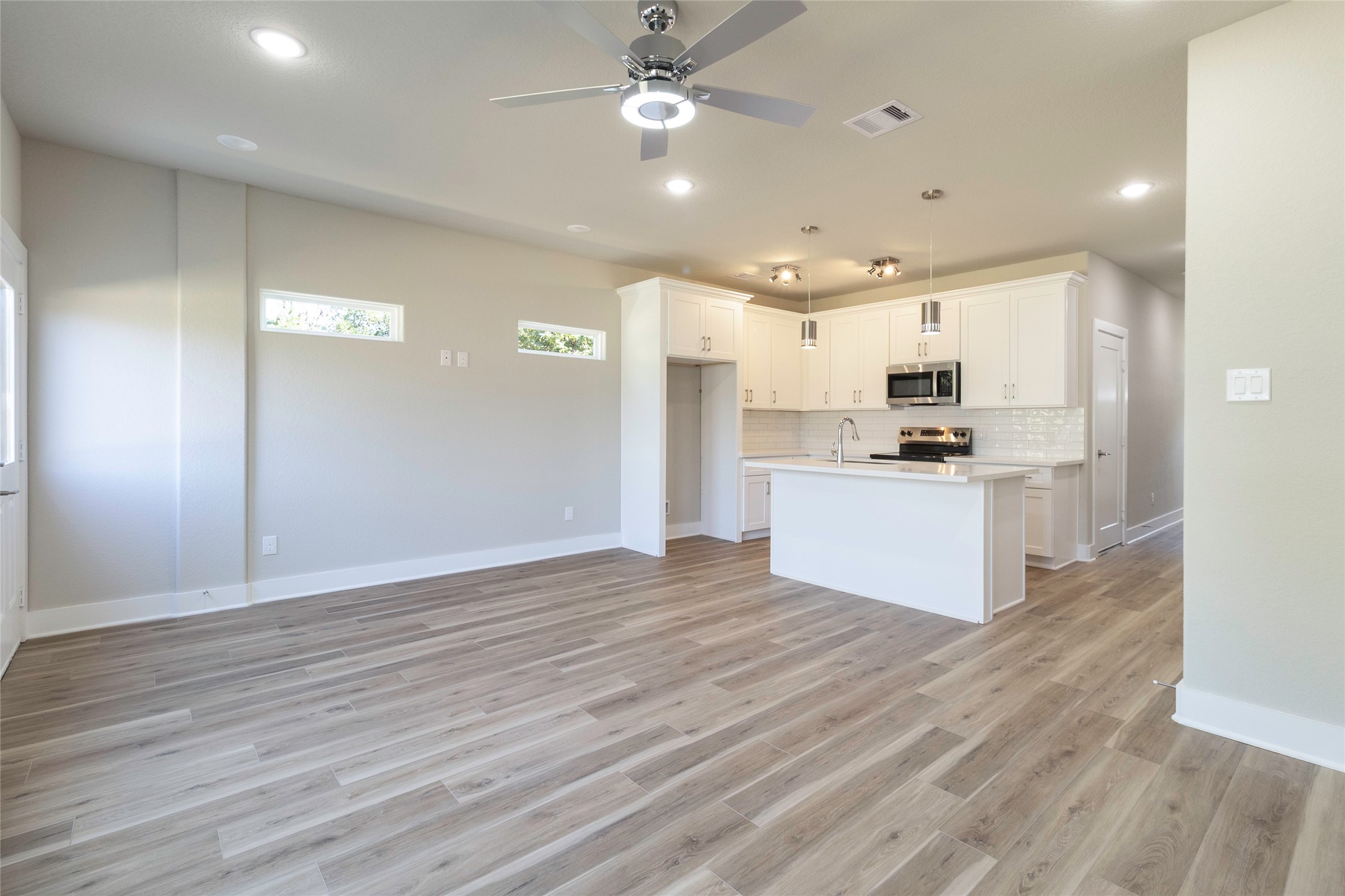 9821 Richcroft Street Houston, TX 77029 - Photo 7 of 15 a view of kitchen with cabinets appliances and wooden floor