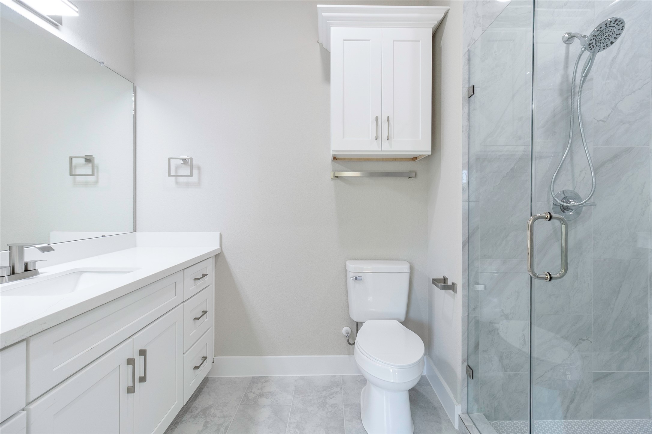 9821 Richcroft Street Houston, TX 77029 - Photo 10 of 15 a bathroom with a granite countertop toilet sink and mirror