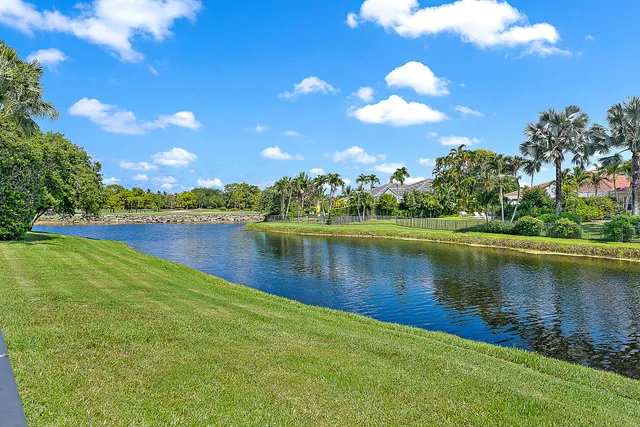 a view of a lake with houses in the back