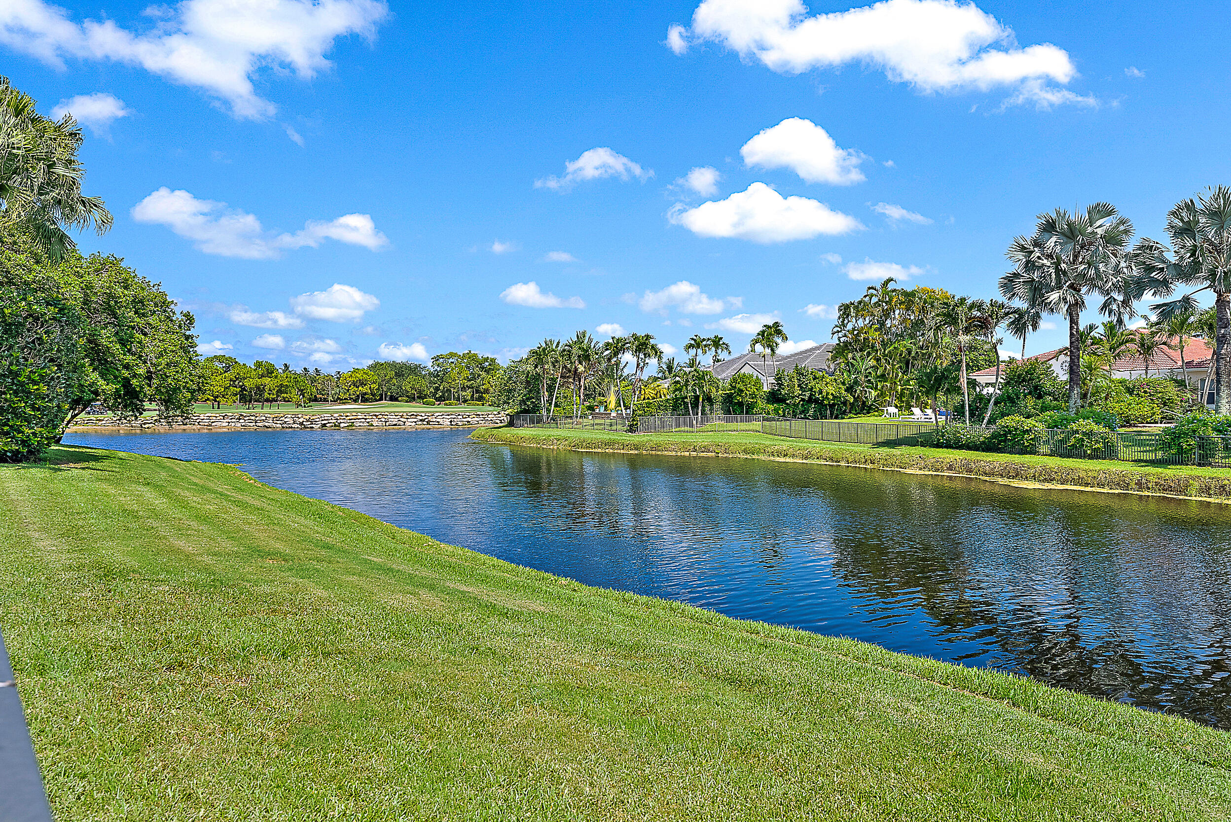 167 North Village Way Jupiter, FL 33458 - Photo 13 of 30 a view of a lake with houses in the back