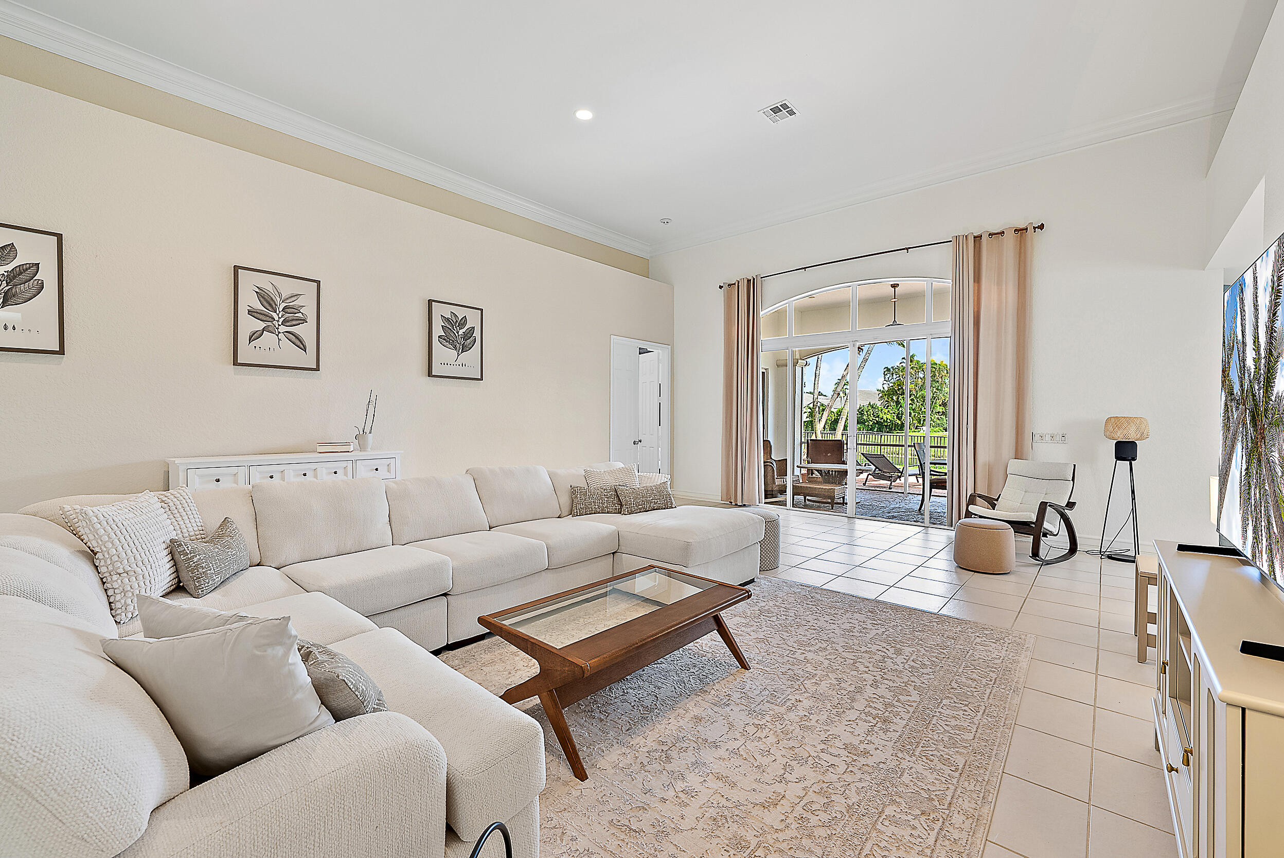 167 North Village Way Jupiter, FL 33458 - Photo 23 of 30 a living room with furniture and a large window