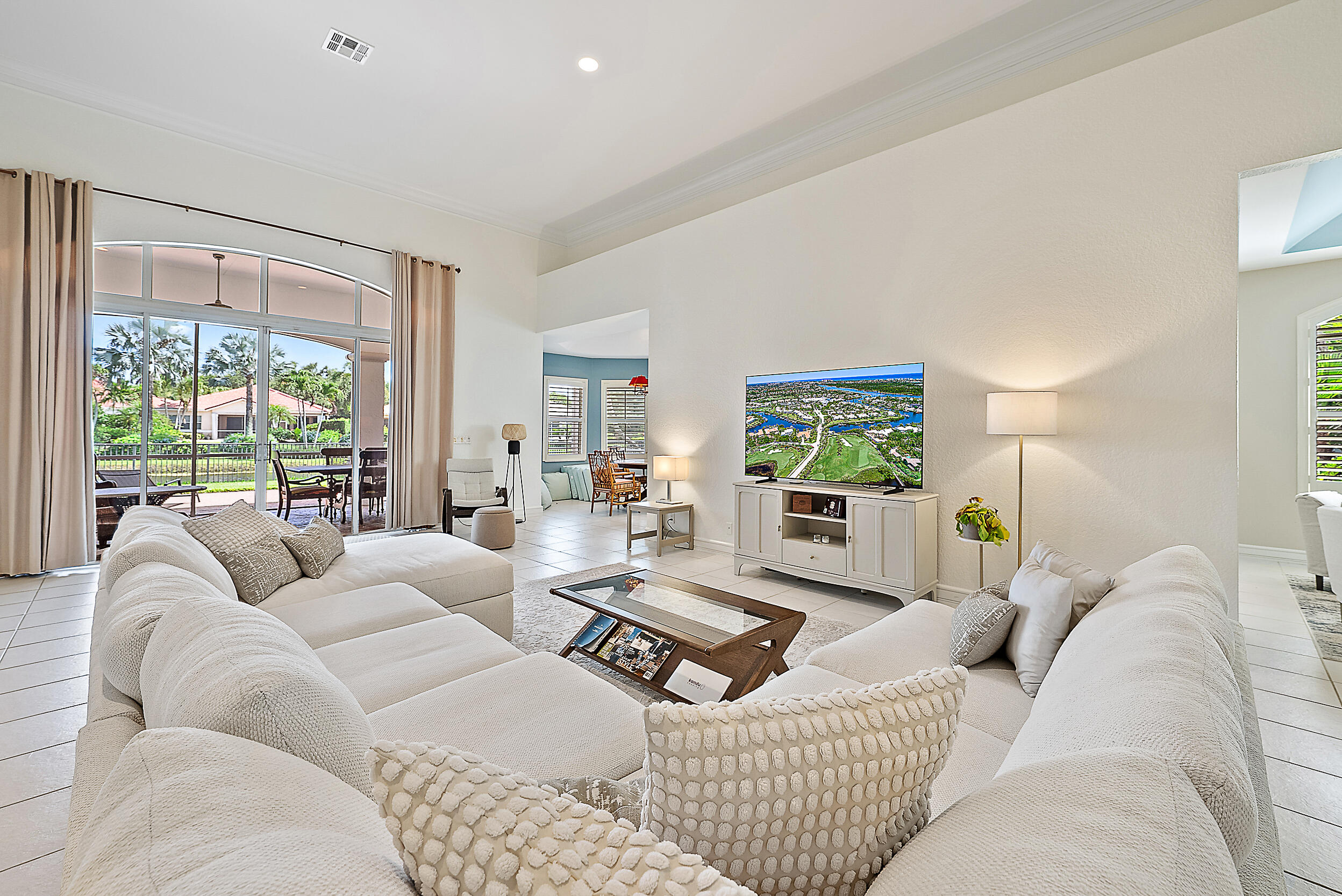 167 North Village Way Jupiter, FL 33458 - Photo 3 of 30 a living room with furniture and a large window