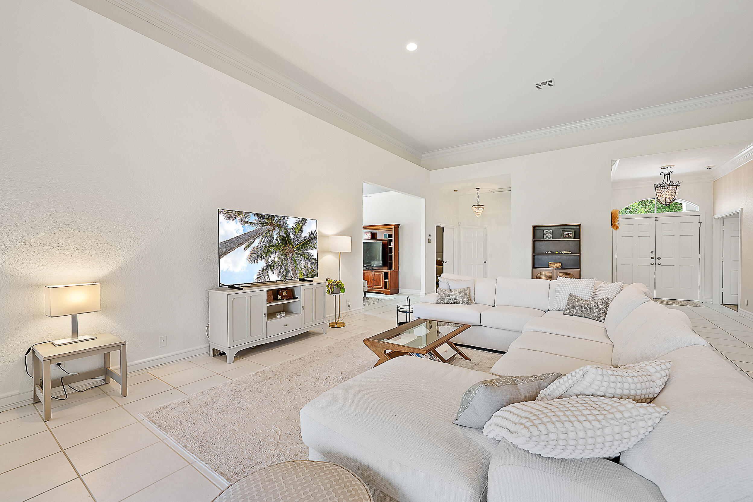 167 North Village Way Jupiter, FL 33458 - Photo 6 of 30 a living room with furniture and a flat screen tv