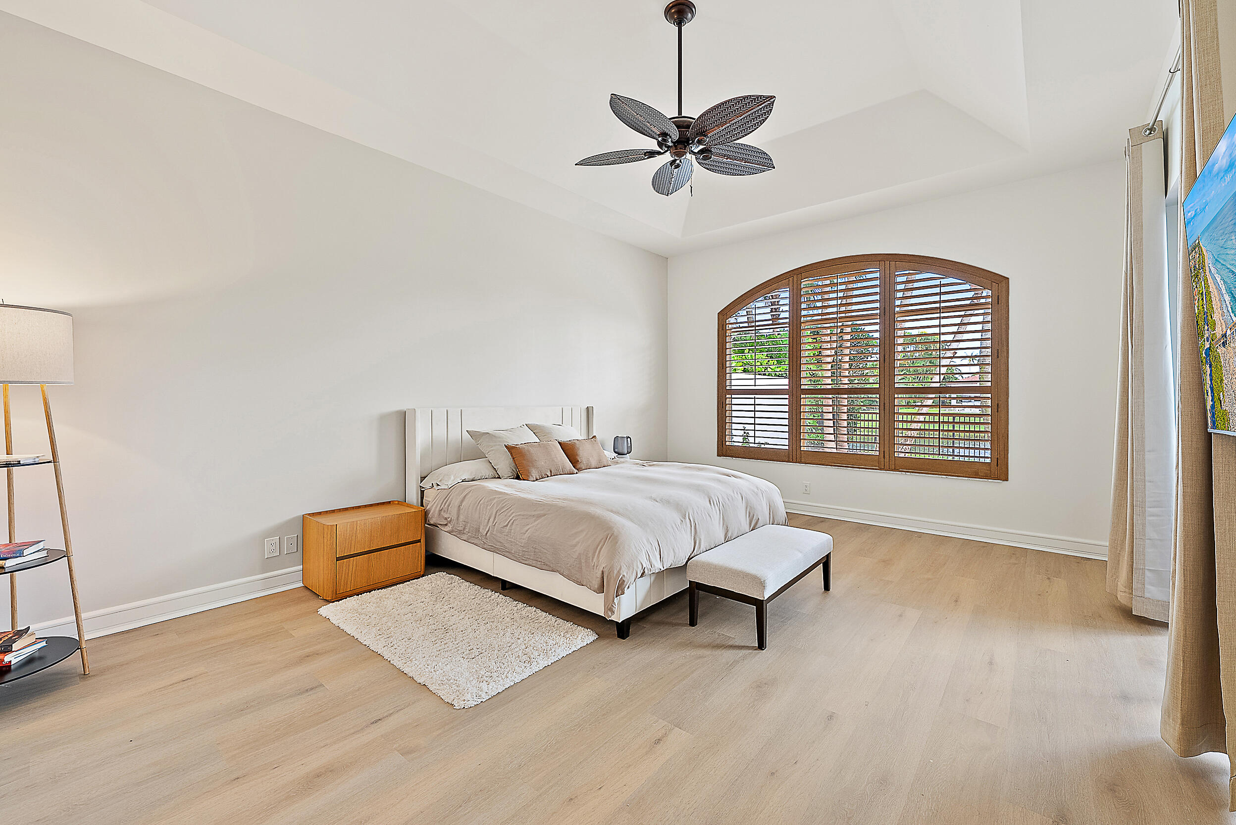 167 North Village Way Jupiter, FL 33458 - Photo 10 of 30 a spacious bedroom with a bed and a window