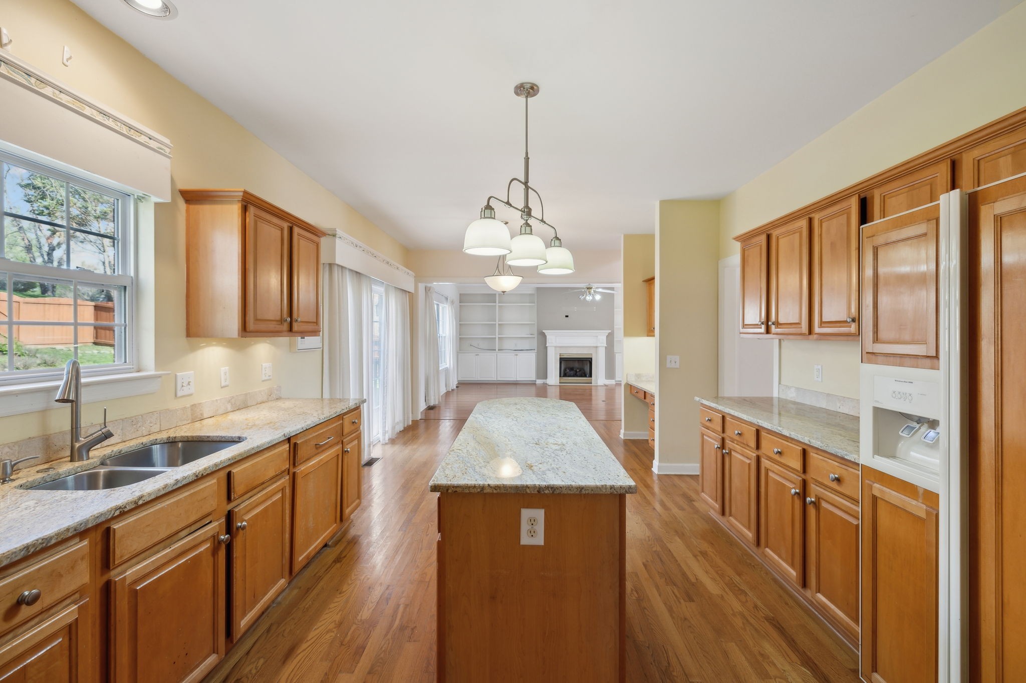 8012 Poplarwood Road Nashville, TN 37221 - Photo 12 of 32 a kitchen with stainless steel appliances granite countertop a sink stove and refrigerator