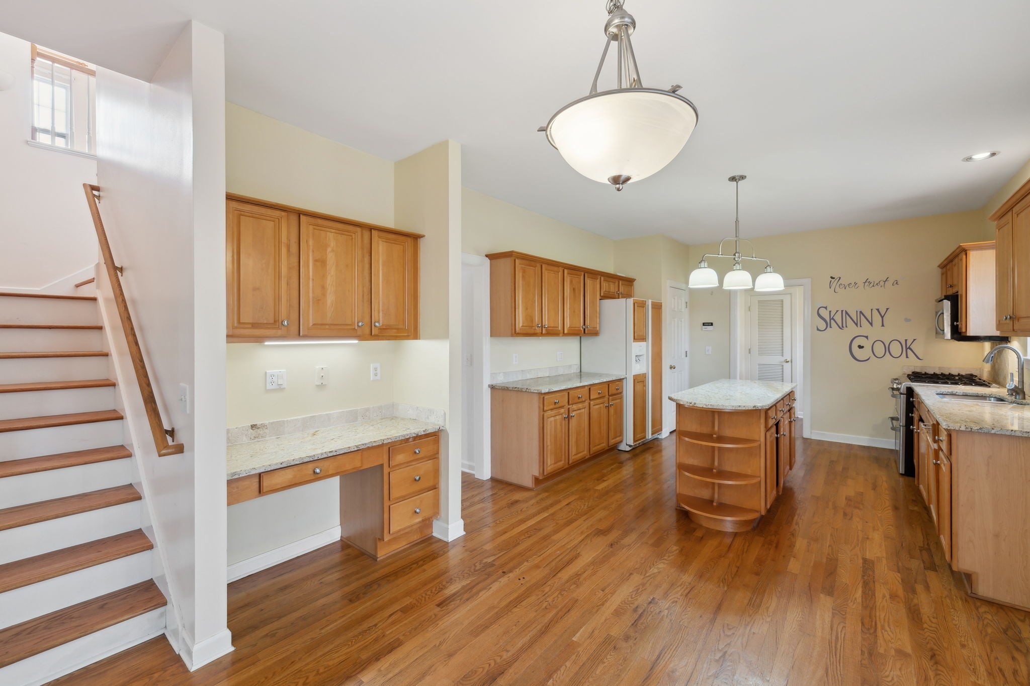 8012 Poplarwood Road Nashville, TN 37221 - Photo 14 of 32 a large kitchen with a table and chairs
