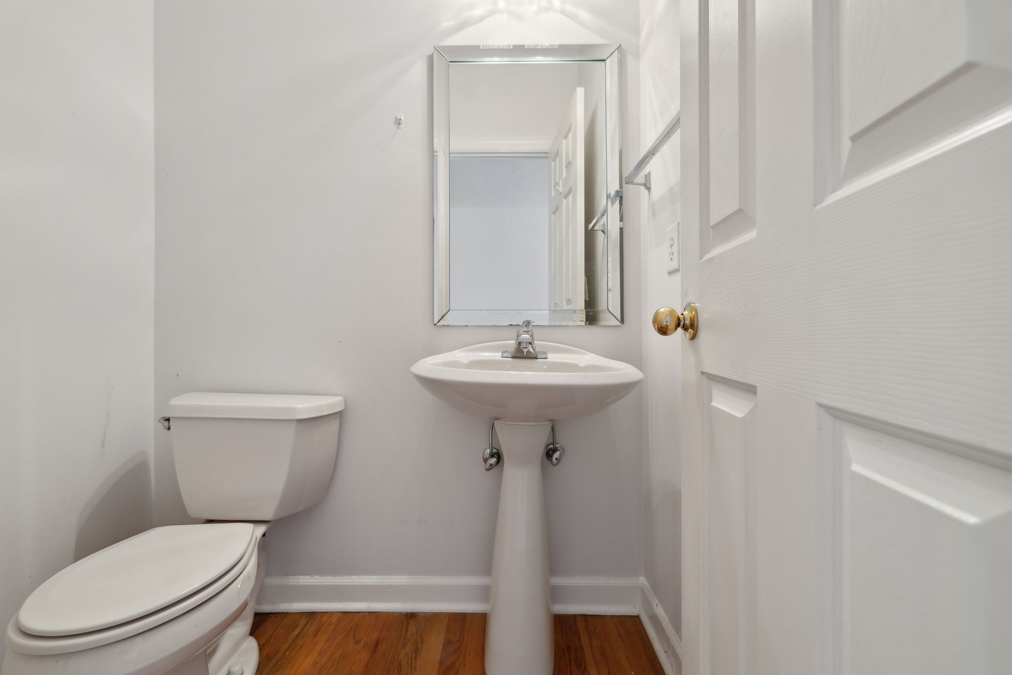 8012 Poplarwood Road Nashville, TN 37221 - Photo 17 of 32 a bathroom with a sink a toilet and mirror