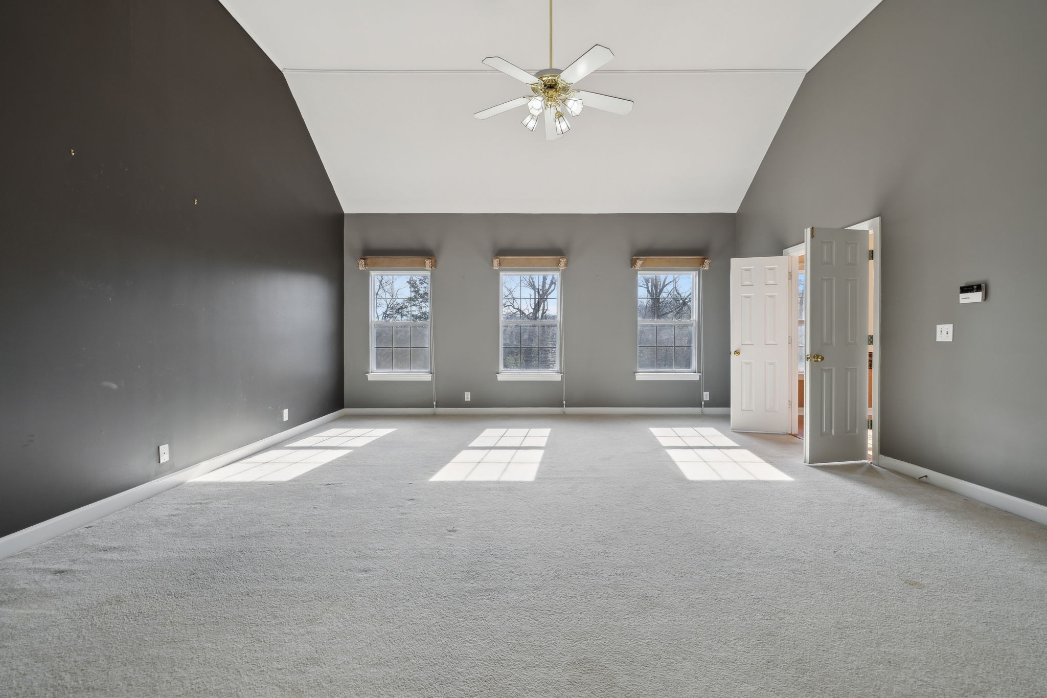 8012 Poplarwood Road Nashville, TN 37221 - Photo 20 of 32 an empty room with windows and ceiling fan