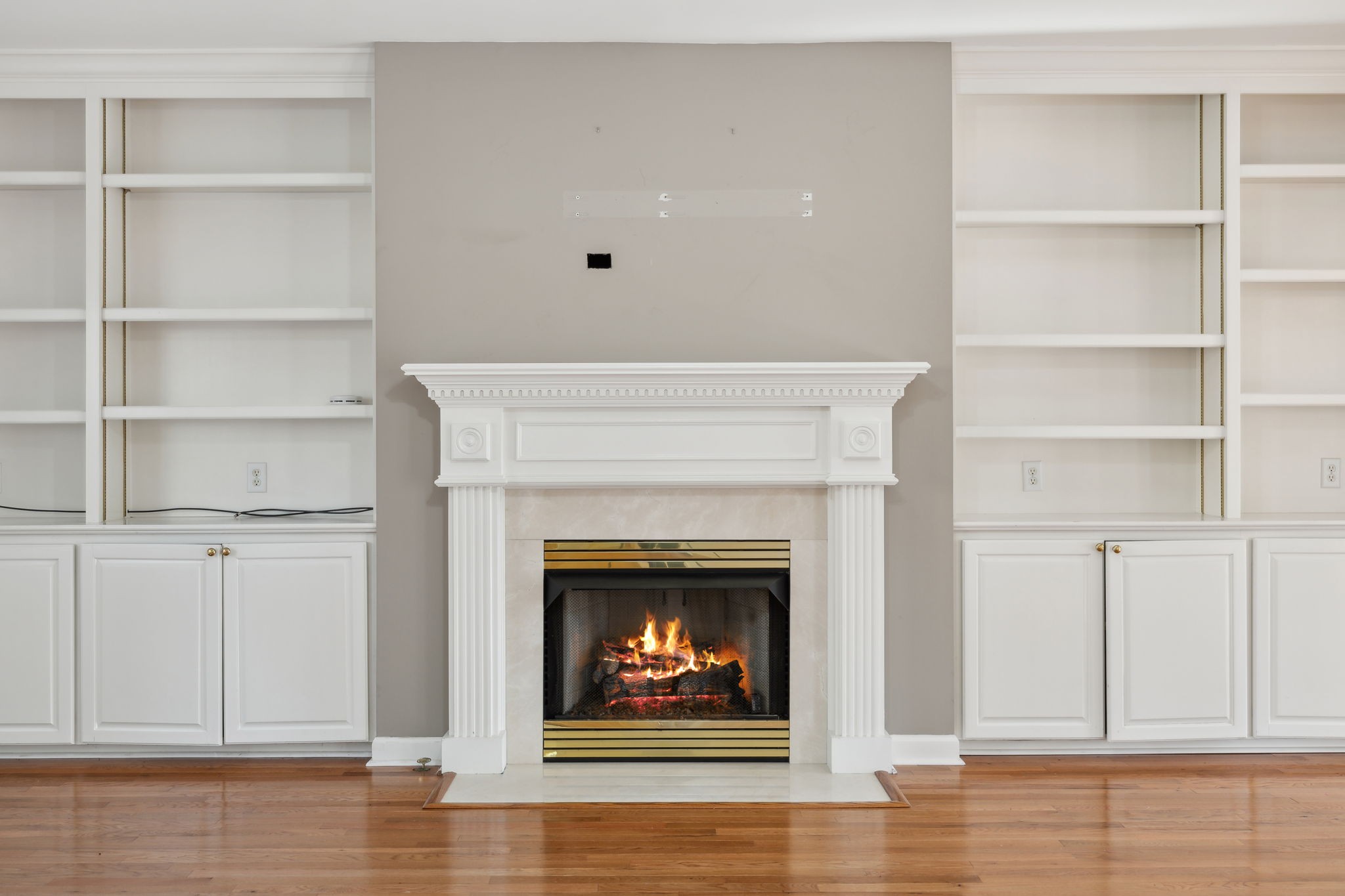 8012 Poplarwood Road Nashville, TN 37221 - Photo 8 of 32 a living room with white cabinets and a fireplace