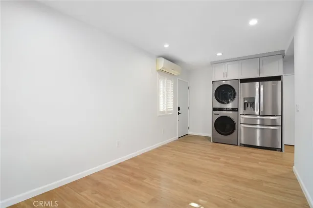 a view of a kitchen with a washer and dryer