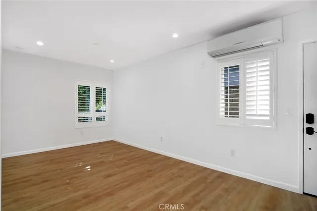 a view of a kitchen with a sink and a refrigerator
