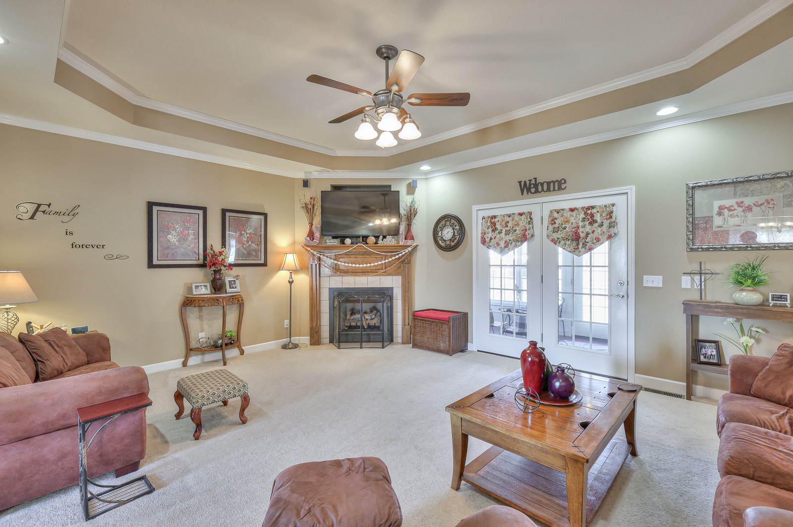 328 Logan Chapel Road Hillsboro, TN 37342 - Photo 7 of 64 a living room with furniture a fireplace and a chandelier