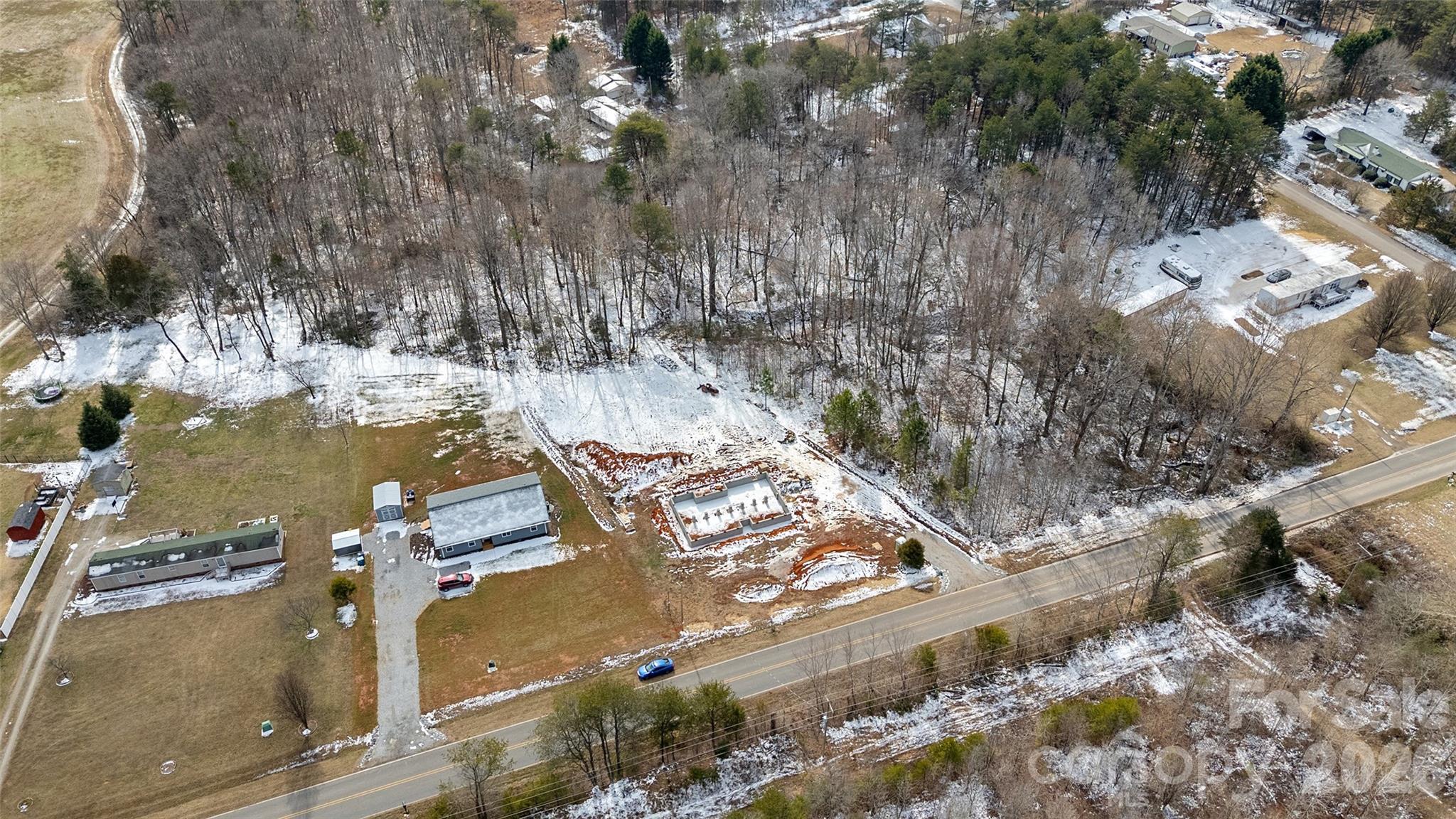 6399 Little Mountain Road, Unit 1 Sherrills Ford, NC 28673 - Photo 28 of 40 an aerial view of a house with a yard