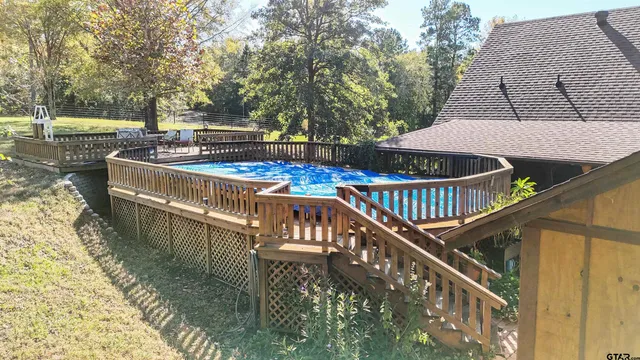 a view of a roof deck with table and chairs
