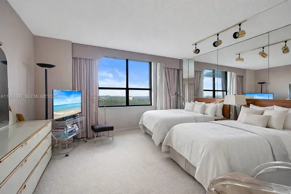 a bedroom with bed and window
