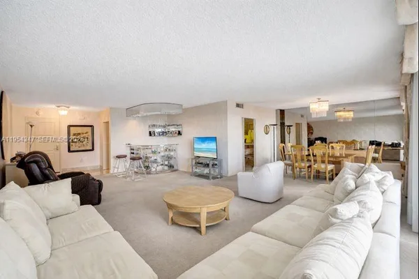 a living room with furniture and a table