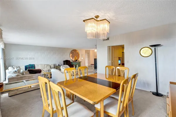 a kitchen with cabinets a sink and white appliances