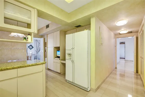 a spacious bathroom with a sink mirror and a bath tub