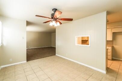 5408 31st Street Lubbock, TX 79407 - Photo 14 of 33 a view of a big room with closet and fan