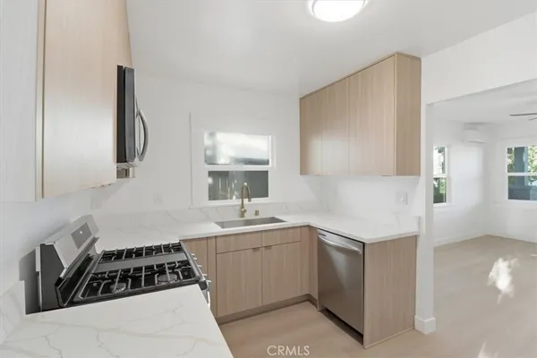 a kitchen with a sink and cabinets