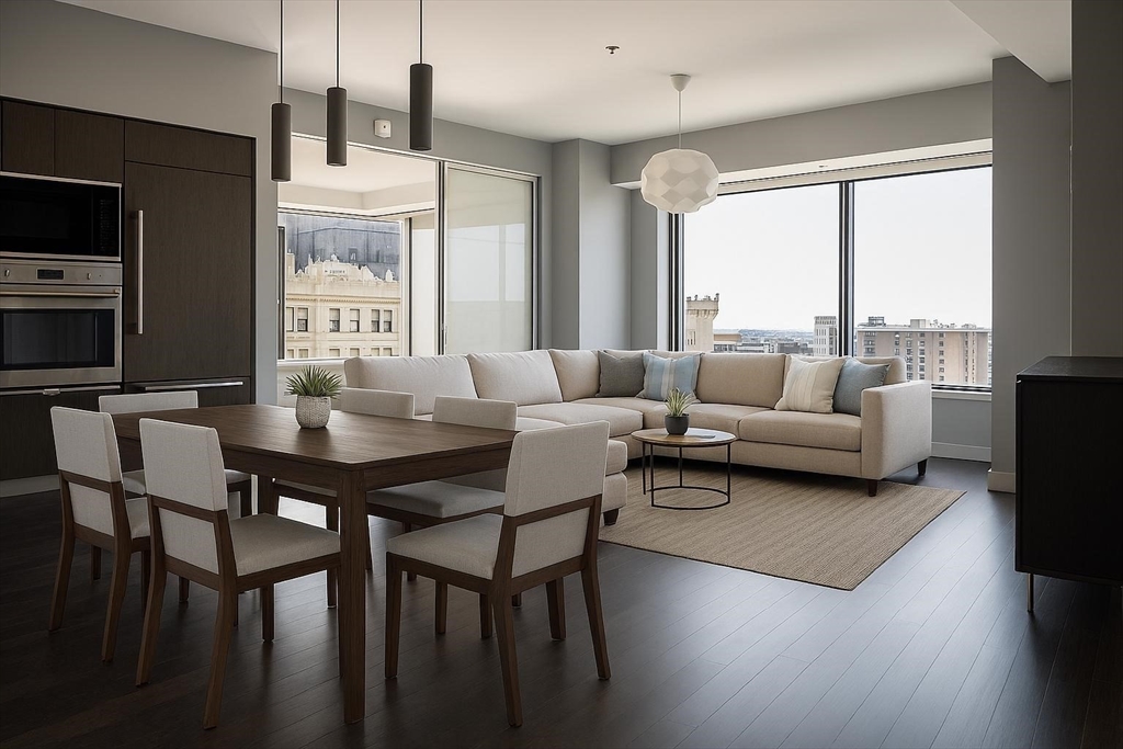 a living room with furniture wooden floor and a flat screen tv