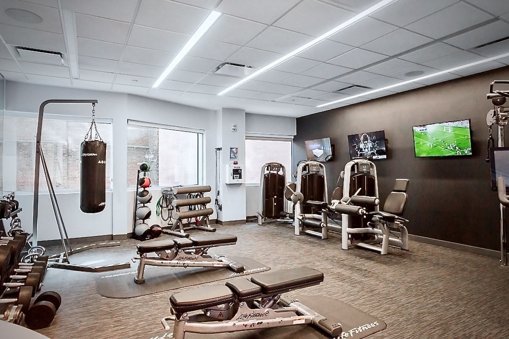 110 Stuart Street, Unit 16H Boston, MA 02116 - Photo 12 of 17 a view of a room with gym equipment
