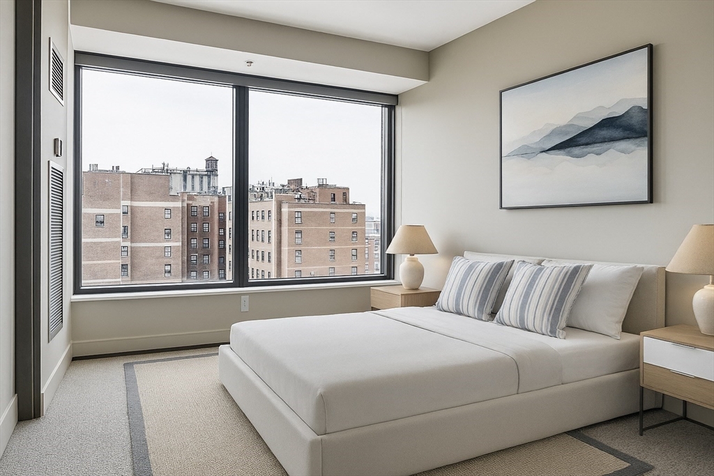 110 Stuart Street, Unit 16H Boston, MA 02116 - Photo 12 of 22 a bedroom with a large bed and a large window