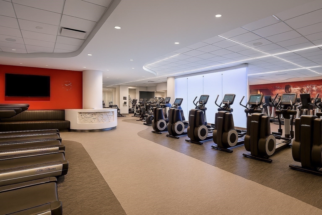 110 Stuart Street, Unit 16H Boston, MA 02116 - Photo 15 of 22 a room with lots of gym equipment and a large window