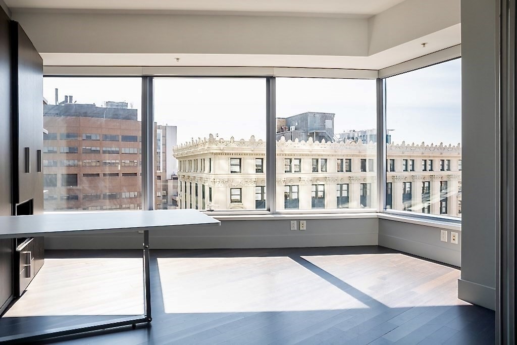 110 Stuart Street, Unit 16H Boston, MA 02116 - Photo 5 of 17 a view of an empty room with a window