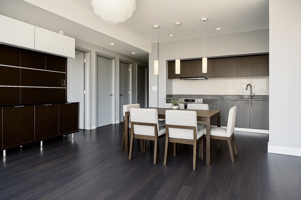 110 Stuart Street, Unit 16H Boston, MA 02116 - Photo 5 of 22 a dining room with furniture and wooden floor