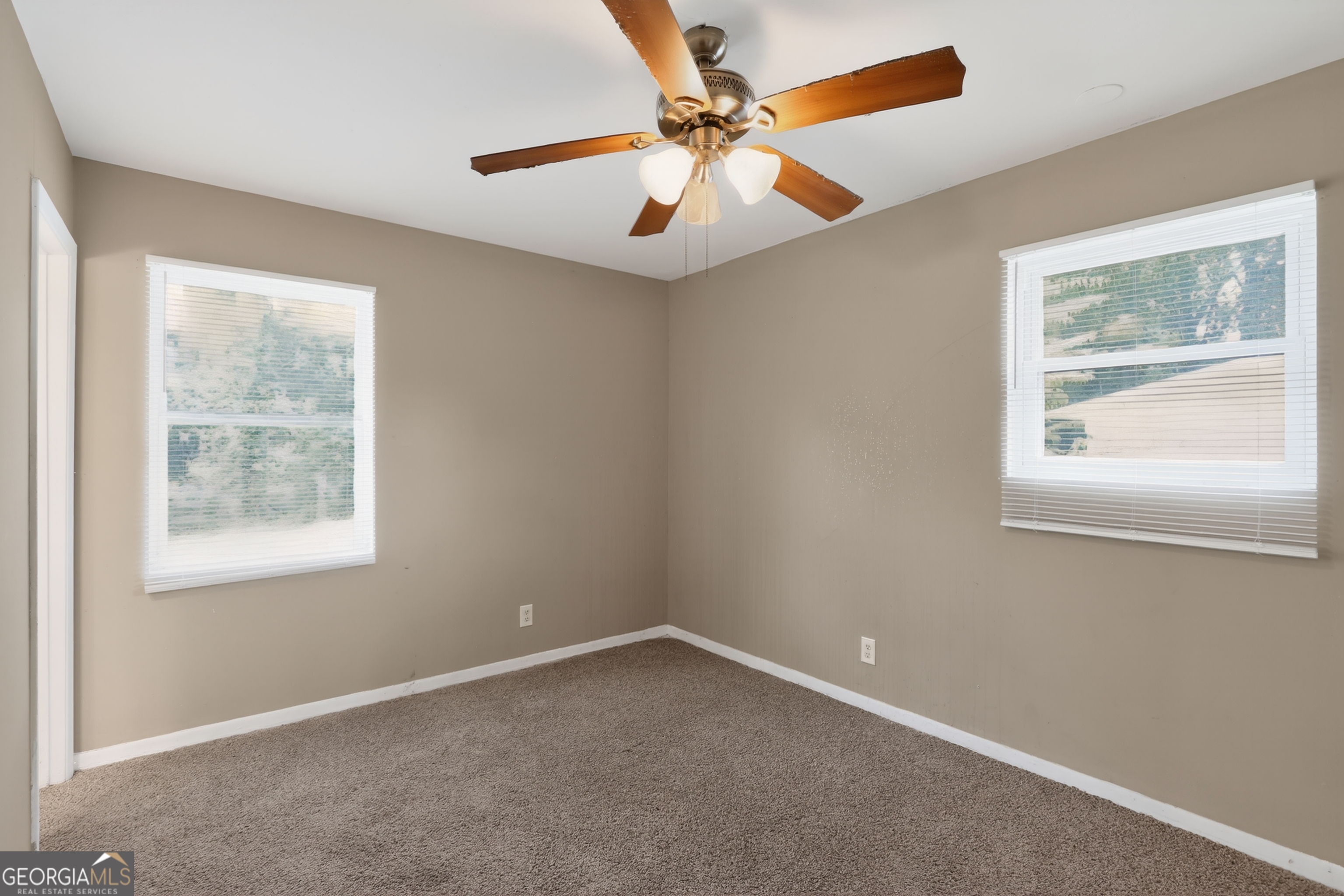 3606 Alene Circle Augusta, GA 30906 - Photo 11 of 30 an empty room with windows and fan