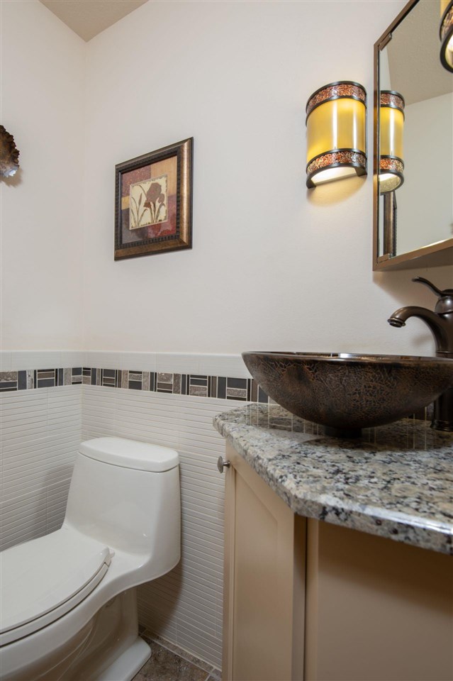 11105 Chicory Ridge Way Roscoe, IL 61073 - Photo 25 of 35 a bathroom with a granite countertop toilet sink and mirror