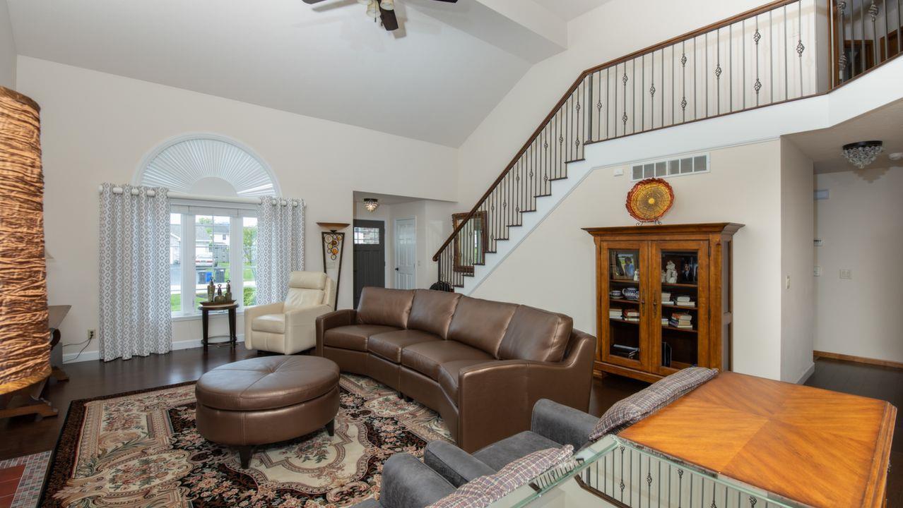11105 Chicory Ridge Way Roscoe, IL 61073 - Photo 7 of 35 a living room with furniture and a chandelier