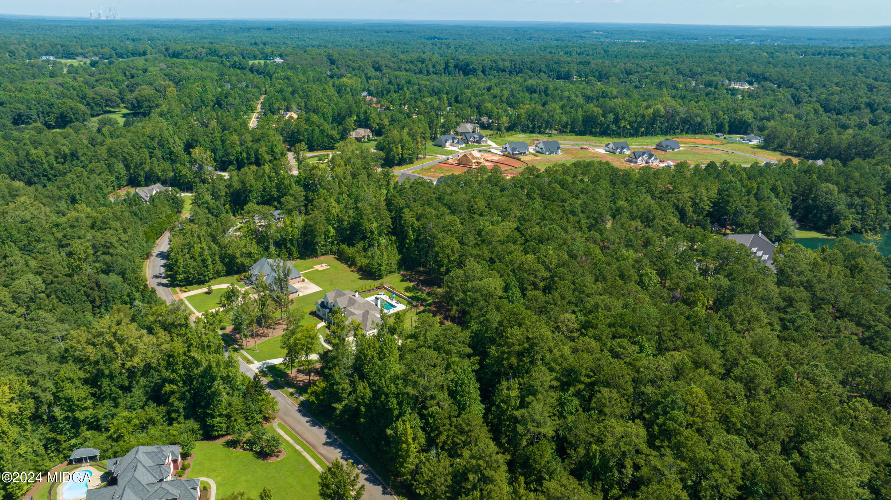153 Camden Trace Macon, GA 31206 - Photo 4 of 8 a view of a lush green field with lots of bushes