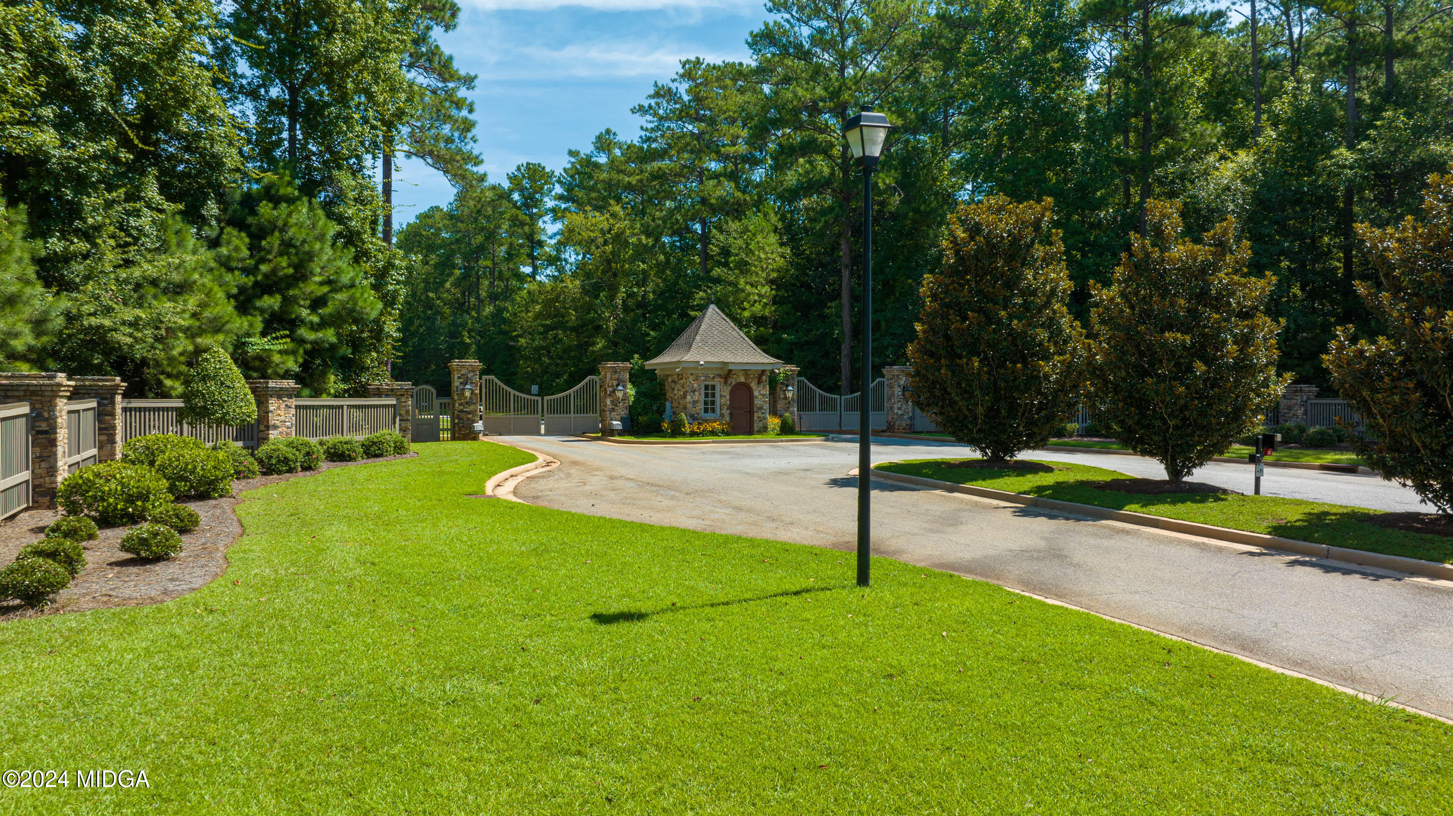 153 Camden Trace Macon, GA 31206 - Photo 6 of 8 a swimming pool with a yard and large trees