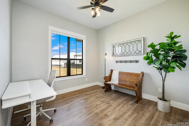 a large kitchen with a table and chairs in it
