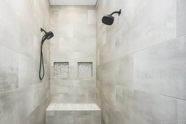 a living room with furniture fireplace and a window