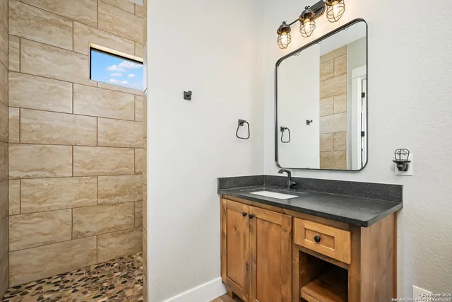 a view of a workspace with furniture and wooden floor