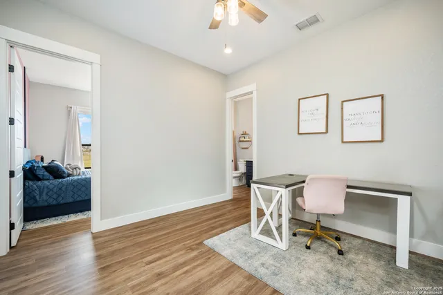a living room with a bed furniture and a window