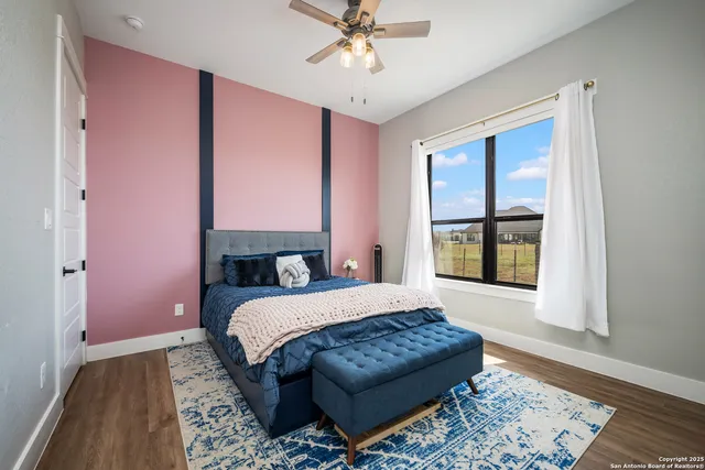 a view of a patio with table and chairs and potted plants