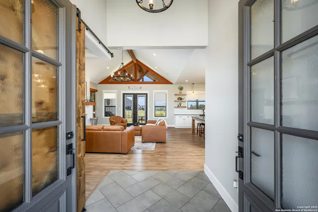 a view of living room with furniture and a window