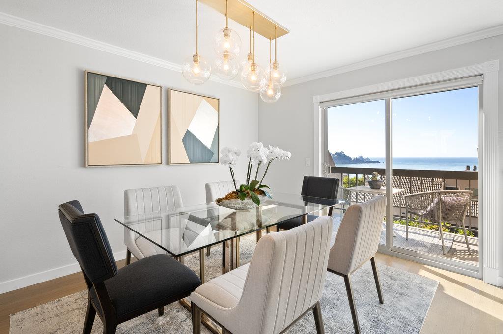 415 Roberts Road Pacifica, CA 94044 - Photo 20 of 69 a dining room with furniture a chandelier and wooden floor