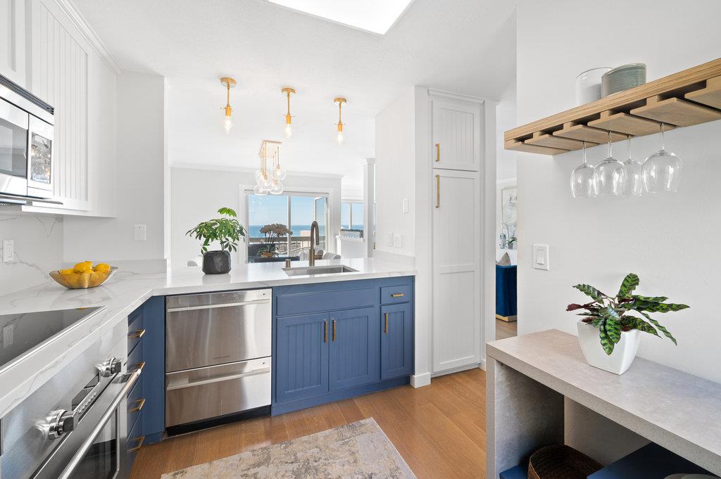 415 Roberts Road Pacifica, CA 94044 - Photo 28 of 69 a kitchen with stainless steel appliances a sink a counter space and a window