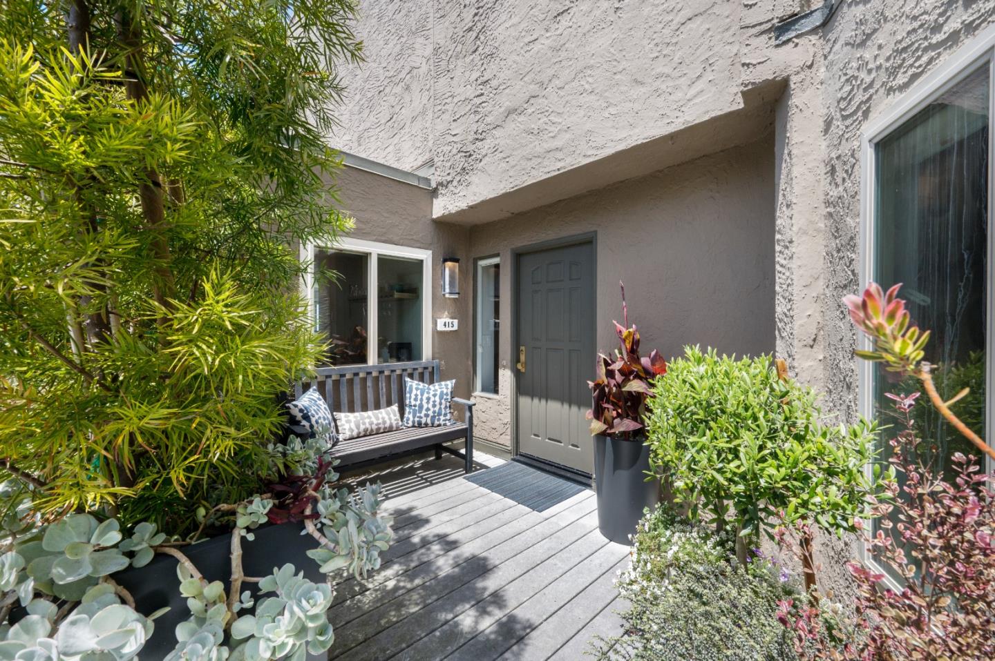 415 Roberts Road Pacifica, CA 94044 - Photo 3 of 69 a house with potted plants in front of door