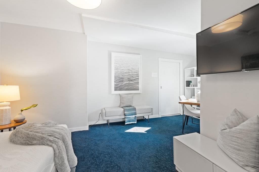 415 Roberts Road Pacifica, CA 94044 - Photo 33 of 69 a living room with furniture and a flat screen tv