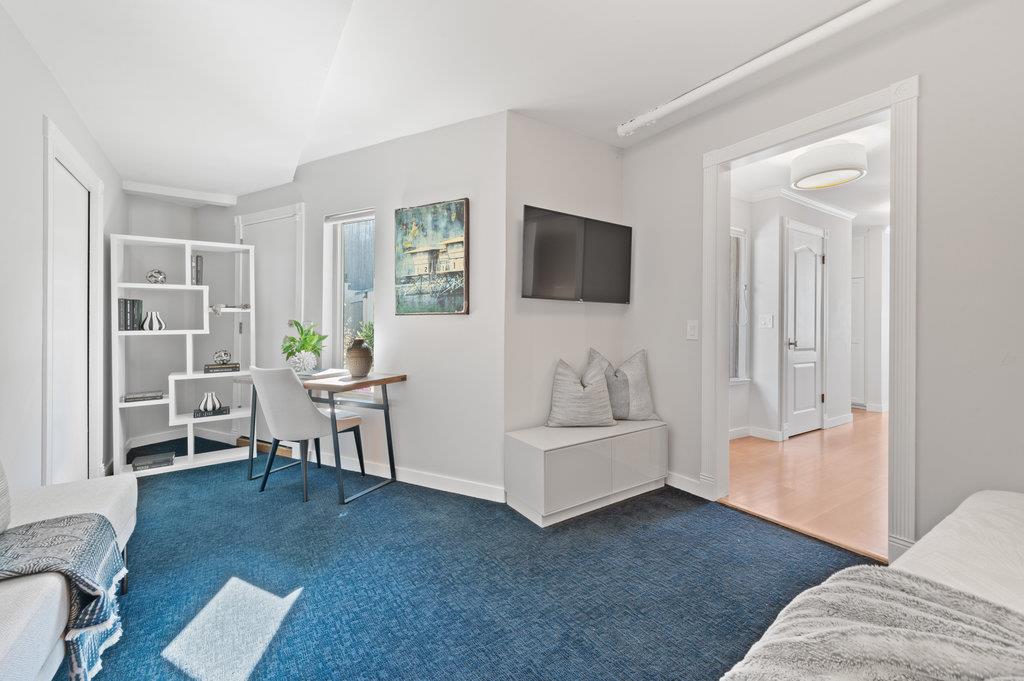 415 Roberts Road Pacifica, CA 94044 - Photo 34 of 69 a living room with furniture and a flat screen tv